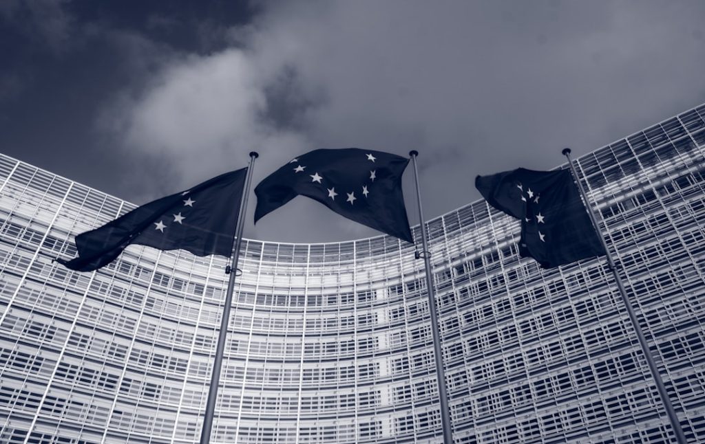 Flags of the European Union in front of the EU-commission building Berlaymont in Brussels, Belgium