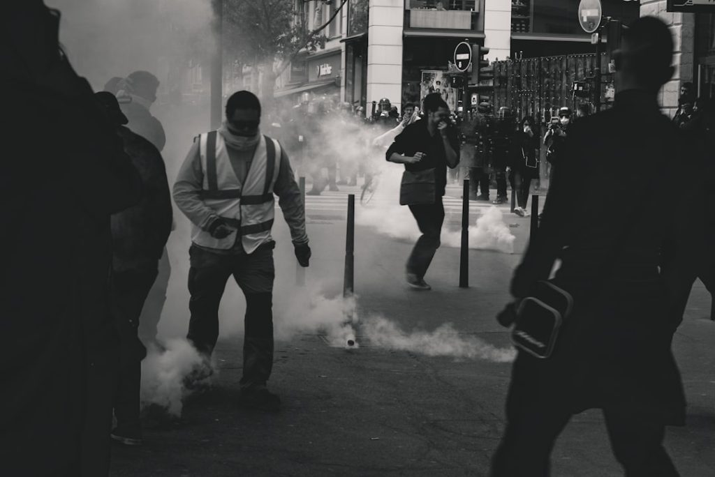 Police fires tear gas at Yellow Vest demonstrators during the 25th weekend of protests in the streets of Lyon, France.

Police violence is at its highest since the 1950s. There is an extensive use of tear gas, sting-ball grenades and LBDs (defense ball launchers) against largely peaceful protestors. According to official numbers, as of now, 1.428  tear gas grenades and 13.460 rubber bullets have been fired.
As of now (May 5th, 2019), 23 persons lost an eye and 5 persons their hand during protests (source: mediapart.fr, http://tiny.cc/6hd85y).